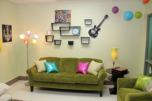 view of couch with decorations on the wall