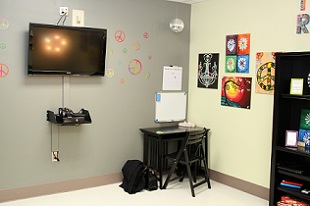 view of desk with television above it